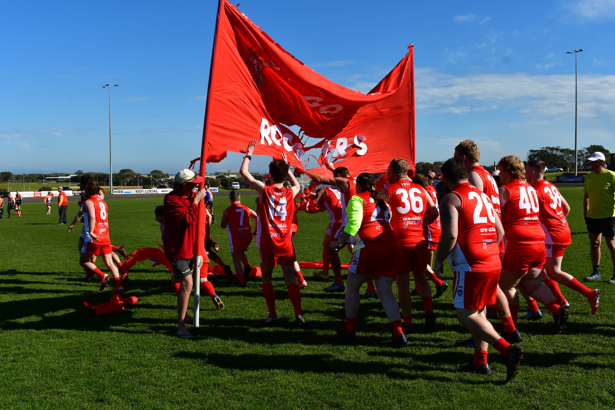 The South Warrnambool Roosters All Abilities team running out onto the field, crowned Football Integration Development Association (FIDA) Western Conference back-to-back premiers!